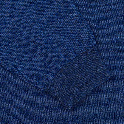 A close up of a Maurizio Baldassari Denim Blue Cotton Mouline 1/4 Zip Sweater.