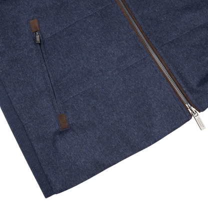 A Maurizio Baldassari Denim Blue Water Repellent Pure Cashmere Gilet with brown zippers.