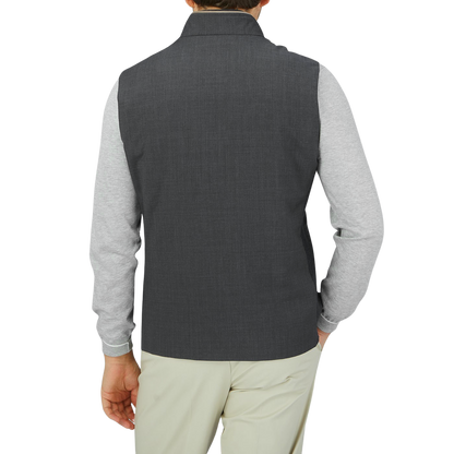 The back view of a man wearing a Maurizio Baldassari Charcoal Grey Merino Wool Travel Gilet.