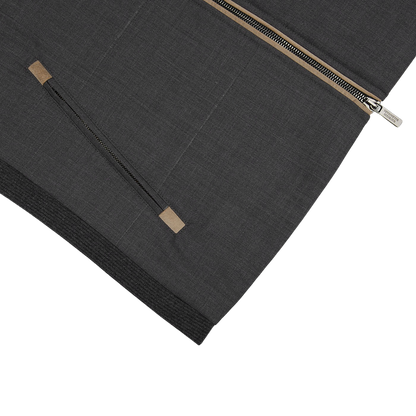 A Charcoal Grey Merino Wool Travel Gilet by Maurizio Baldassari with a zipper on it.