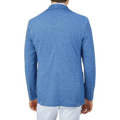 The back view of a man wearing a Maurizio Baldassari Light Blue Wool Linen Silk Jersey Blazer.