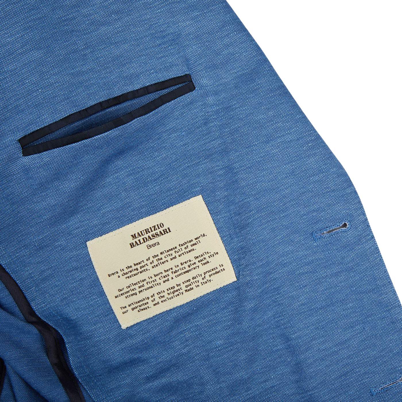 A Maurizio Baldassari light blue wool linen silk jersey blazer with a label on it.