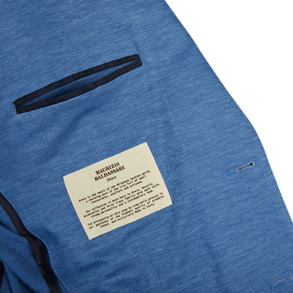 A Maurizio Baldassari light blue wool linen silk jersey blazer with a label on it.