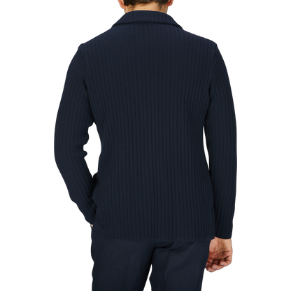 The back view of a man wearing a Maurizio Baldassari Navy Blue Organic Cotton Rib Stitched Swacket.