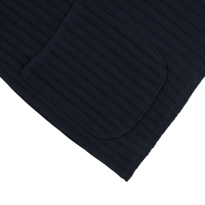 A close up of a Maurizio Baldassari navy blue organic cotton rib stitched swacket.
