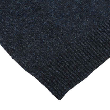 Close-up of the corner of the Maurizio Baldassari Navy Winter Wool Mouline 1/4 Zip Sweater, showcasing its ribbed texture and rich Tasmanian wool.