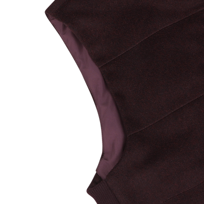Close-up of the Maurizio Baldassari Plum Water Repellent Cashmere Gilet, revealing the seam and lining on the inner side.