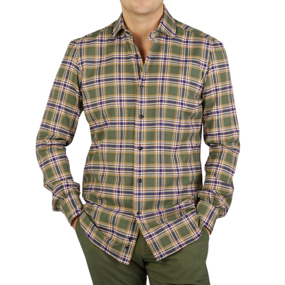 A man wearing a Green Checked Brushed Cotton Regular Shirt, reminiscent of Mazzarelli's impeccable craftsmanship.