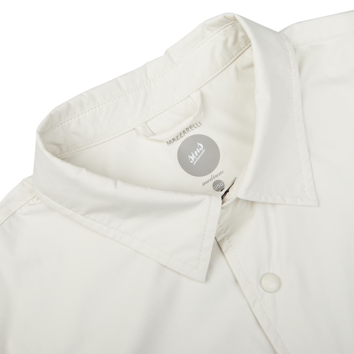 Close-up view of a beige Mazzarelli Off-White Nylon Water Resistant Overshirt collar displaying a brand label.