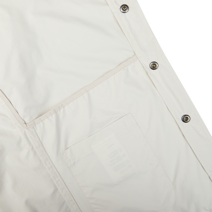 Water-resistant Off-White nylon fabric with snap buttons and a transparent pocket detail by Mazzarelli.