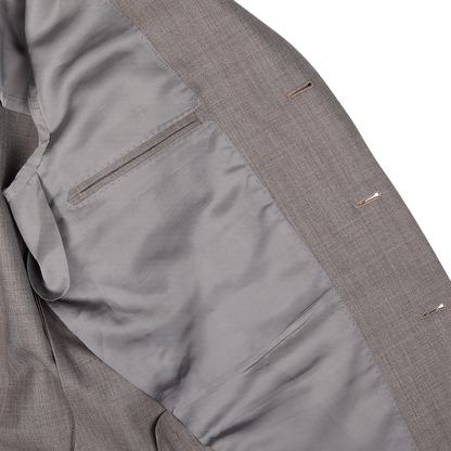 Close-up of a Ring Jacket mid gray high-twist wool suit jacket with visible pocket and seam details.