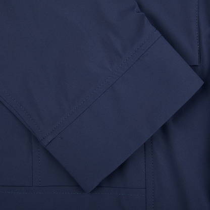 A close up of a Moorer Dark Blue Lightweight Nylon Field Jacket with pockets.