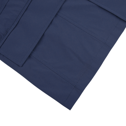A close up of a Moorer Dark Blue Lightweight Nylon Field Jacket with pockets.