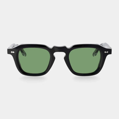 Front view of TBD Eyewear Ply Black | Green sunglasses with thick black rims, bold geometric design, green lenses, wide temples, silver rivets by the hinges, and a keyhole bridge. Handcrafted in Italy. , available at Richard Gelding Mayfair
