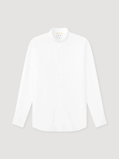 The White Poplin Mandarin Collar Shirt by Coconut Residence is crafted from 100% cotton poplin, featuring a clean, minimalist design with no visible pockets or patterns, and is shown against a light gray background. , available at Richard Gelding Mayfair