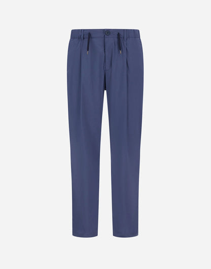 The Herno Blue Lightweight Nylon Drawstring Casual Trousers feature a flat front, pleats, straight-leg cut, side pockets, belt loops, button closure, and a slight sheen—all set against a plain white background. , available at Richard Gelding Mayfair