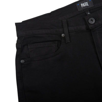 Close-up of black Paige Federal shorts with a focus on the pocket detailing and brand label, crafted from contemporary comfortable transcend fabric.
