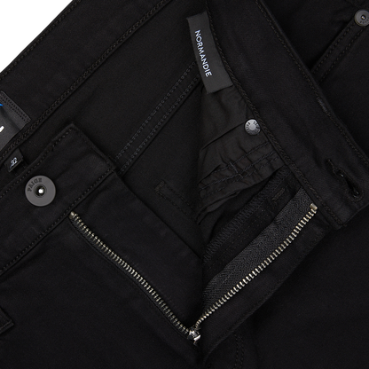 Black jacket with zipper and buttons, featuring a visible Paige jeans brand label.