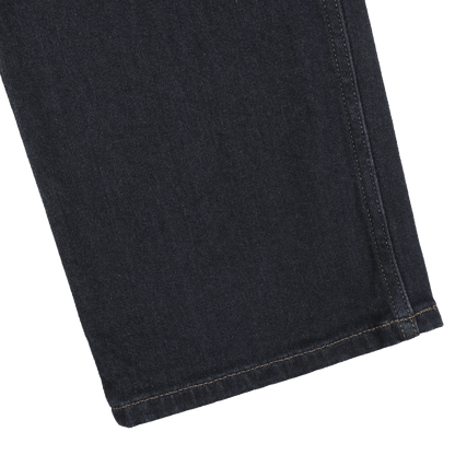 Close-up of the dark denim fabric showcasing a section of the Blue Faded Cotton Cramer Normandie Jeans by Paige, highlighting the straight leg design with visible stitching along the hem and seam, emphasizing its cotton stretch blend.
