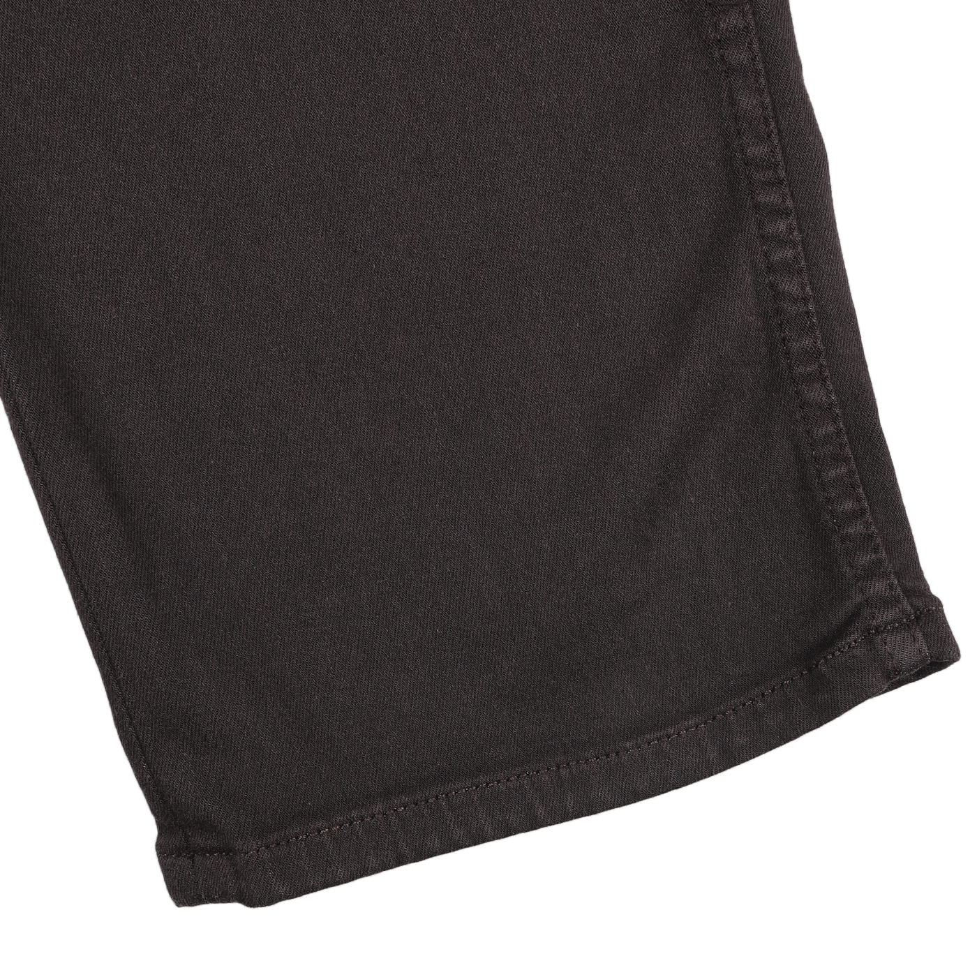 Close-up view of the hem of Paige's Brown Cotton Transcend Normandie Jeans on a white background.