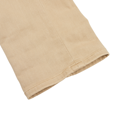 Close-up of a beige fabric sleeve with visible stitching on a white background, showcasing the comfortable fit and quality craftsmanship typical of Paige Caramel Beige Cotton Transcend Federal Slim Jeans.