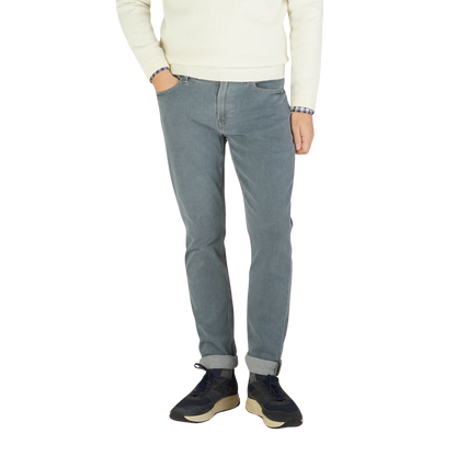 Paige wearing Grey-Blue Cotton Stretch Lennox Jeans and a sweater.