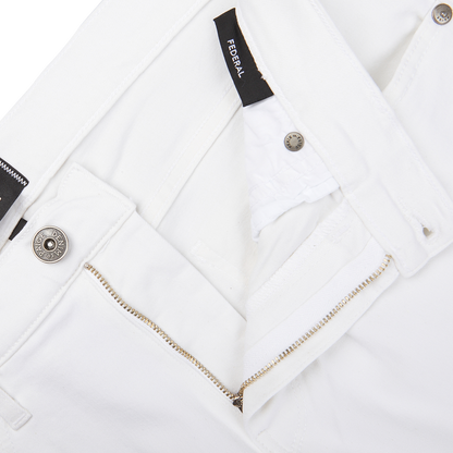 Close-up of Icecap White Cotton Transcend Federal Slim Paige jeans with zipper and button details.