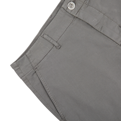 Close-up of a Slate Grey Cotton Blend Phillips Shorts pocket with a button on a white background.