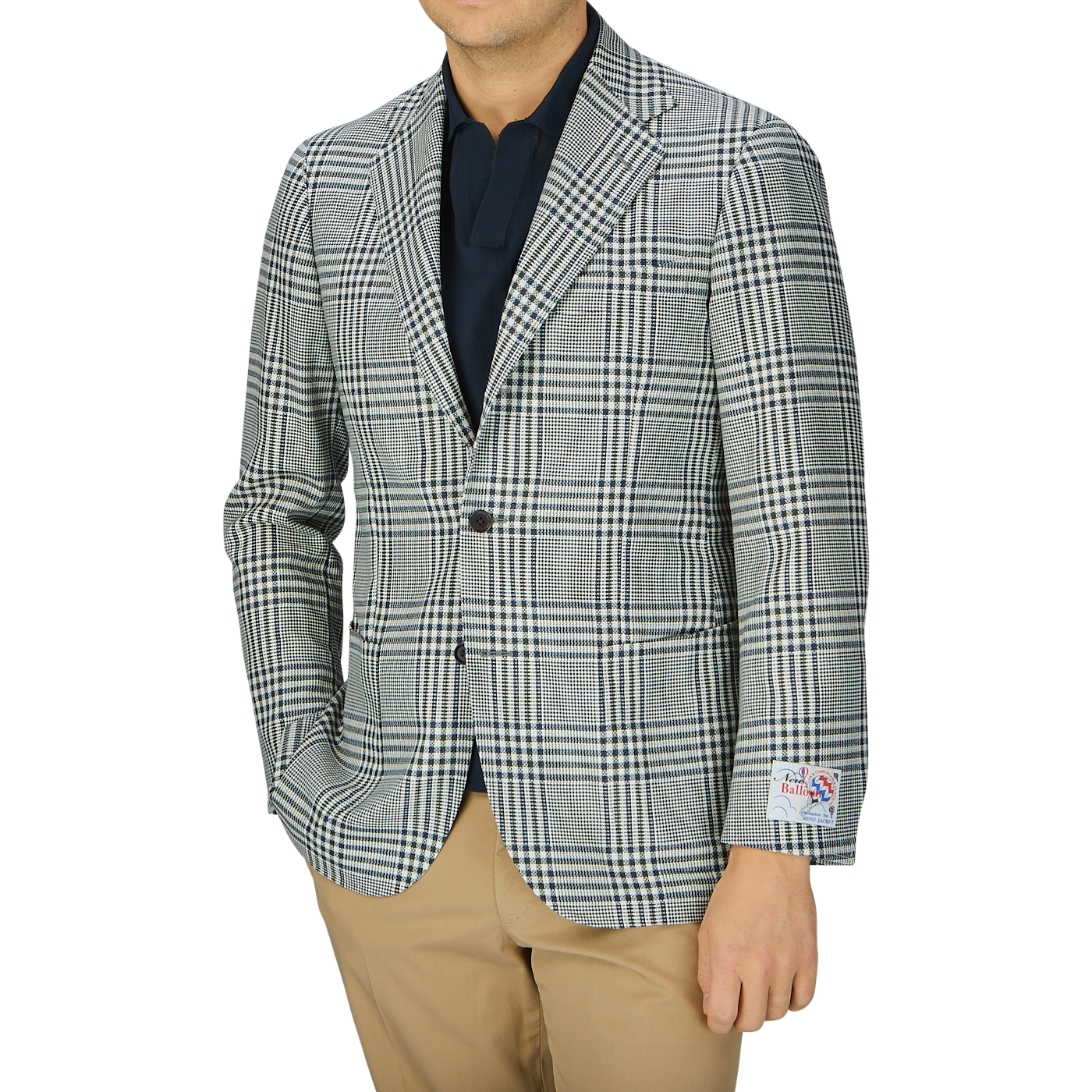 A man wearing a Ring Jacket Blue Green Glen Check Balloon Wool blazer, beige pants, and a dark shirt, photographed from neck to waist against a grey background.