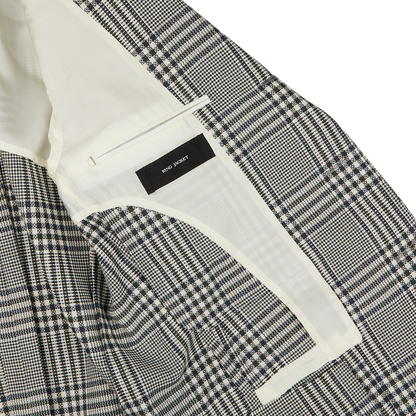 Close-up of a black and white checkered Ring Jacket with a white inner lining and a visible brand label reading "Ring Jacket".