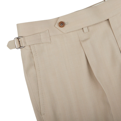 A close up of beige slacks in a Ring Jacket Light Beige Herringbone Wool Suit made of virgin wool.