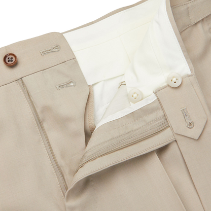 A pair of Light Beige Herringbone Wool Suit trousers by Ring Jacket with a button on the pocket.