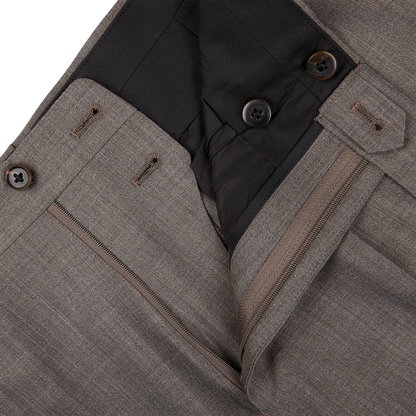 Close-up of a layered Mid Grey High-Twist Wool Suit jacket by Ring Jacket with zipper and button details.