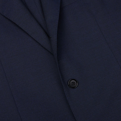 Close-up of a Ring Jacket navy blue high twist wool suit jacket with a single visible button crafted from fresco fabric.
