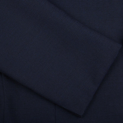 Close-up of a Navy Blue High Twist Wool Suit fabric texture from Ring Jacket, possibly from a garment, showing detailed weave patterns and light folds.