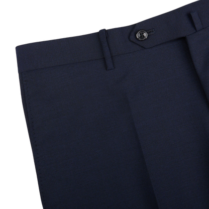 Close-up view of Ring Jacket navy blue high twist wool suit pants featuring a button closure and tailored details on a light background.