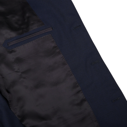 Close-up view of a Ring Jacket Navy Blue High Twist Wool Suit with detailed stitching and a pocket on the inside lining.