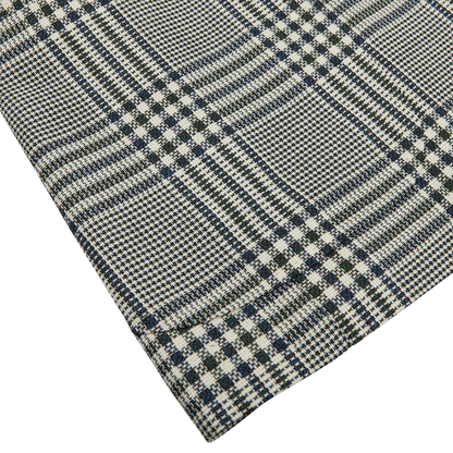 Close-up of a Ring Jacket Blue Green Glen Check Balloon Wool Blazer with a black and white houndstooth pattern.