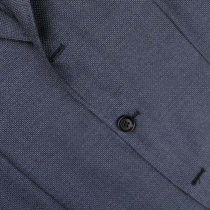 Close-up of the Denim Blue Wool Balloon Travel Blazer by Ring Jacket, featuring a textured open-weave design with a black button fastening, ideal as a versatile sports coat.