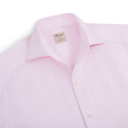 A neatly folded Stenströms Light Pink Stripe Cotton/Linen Shirt with long sleeves, thin pink and white stripes, a pointed collar, white buttons, and a “Stenströms” label inside the collar. , available at Richard Gelding Mayfair