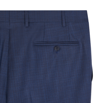 Close-up of the upper back of the Canali Mid Blue Micro Design Wool Suit pants, featuring a single welt pocket with button closure, belt loops, and a refined crosshatch pattern that showcases premium craftsmanship. , available at Richard Gelding Mayfair