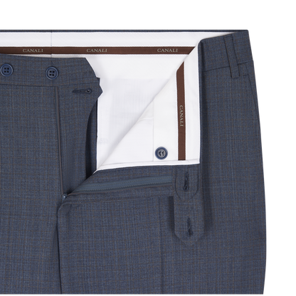 Close-up of Canali's Blue Texture Design Wool Suit trousers, featuring a subtle plaid pattern, open waistband with white branded lining, belt loops, zipper fly, and blue buttons—ideal for men’s formalwear. , available at Richard Gelding Mayfair