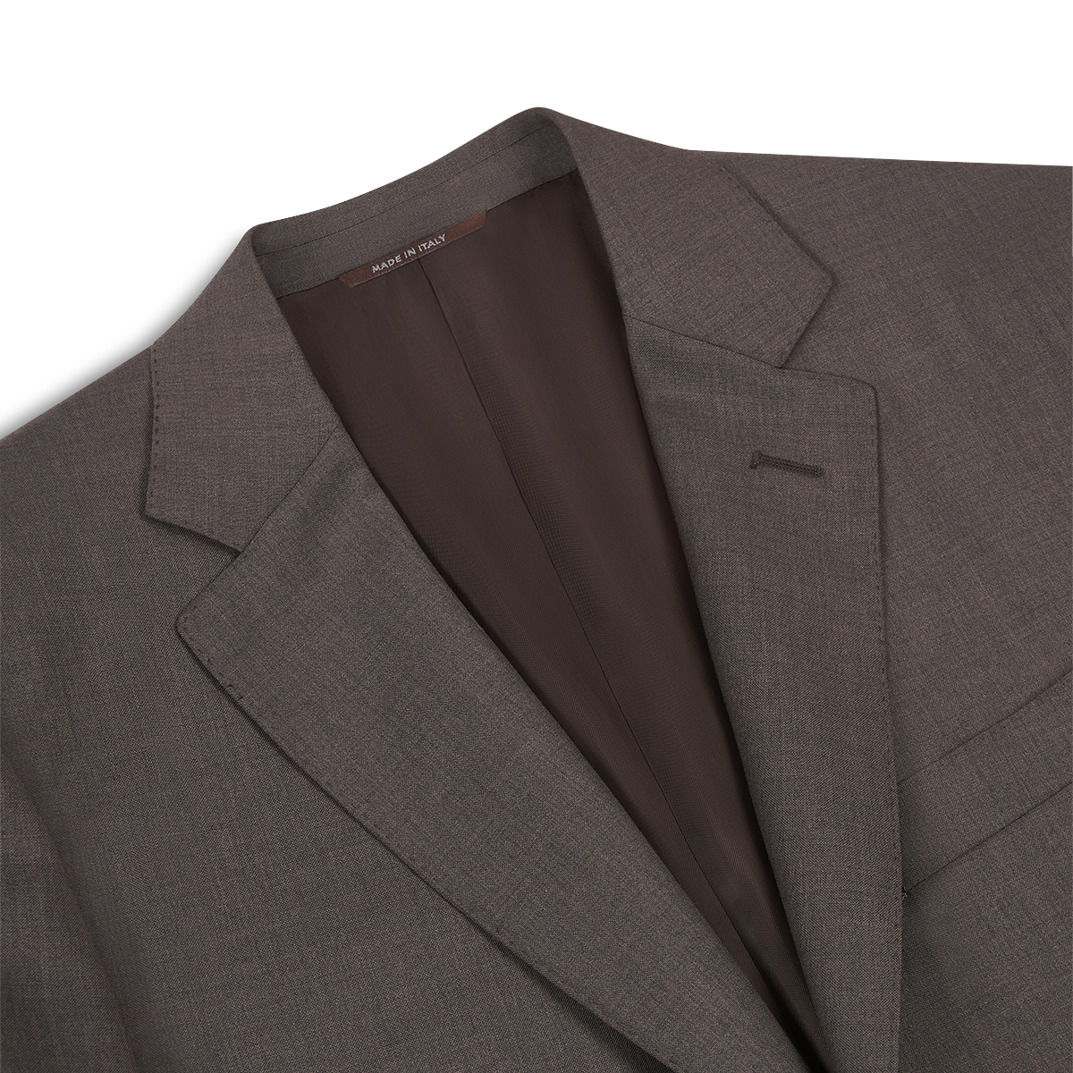 A close-up of the Canali Dark Brown Tropical Wool Suit highlights its notched lapel, chest pocket, visible brown lining, and a “MADE IN ITALY” collar tag. The fabric is smooth and finely woven. , available at Richard Gelding Mayfair
