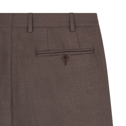 Close-up of Canali's Dark Brown Tropical Wool Suit pants, crafted from textured fabric with a single buttoned back pocket, belt loops, and a pressed seam. The plain white background highlights their classic style. , available at Richard Gelding Mayfair