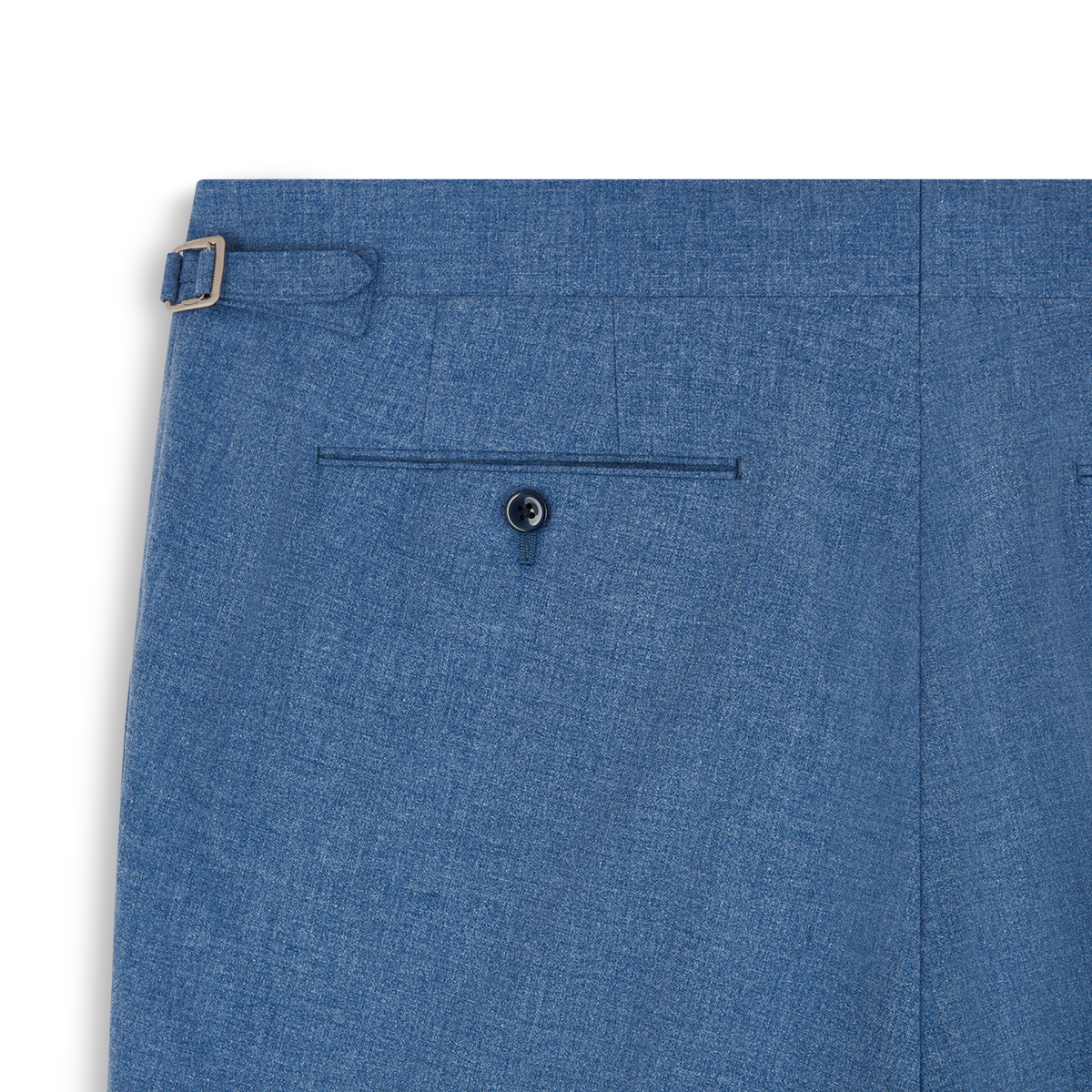 Close-up of the back of Ring Jacket's Pale Blue Melange Tropical Wool/Cotton/Silk Suit pants, showing two welt pockets—one with a black button—and a silver-buckled side adjuster. The finely woven fabric appears lightweight. , available at Richard Gelding Mayfair