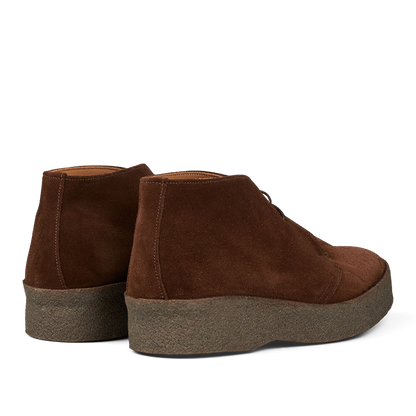 A pair of Polo Snuff Suede Hi Top Boots by Sanders with a rubber crepe sole on a transparent background.