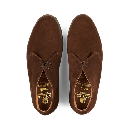 A pair of Polo Snuff Suede Hi Top Boots by Sanders with a rubber crepe sole, viewed from above.