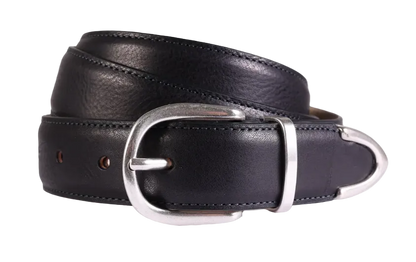 The Amanda Christensen Black Leather 30mm Width Tipped Belt is coiled to showcase its stitched edges, smooth glossy finish, and polished silver oval buckle against a plain light gray background. , available at Richard Gelding Mayfair