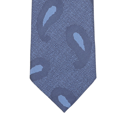 A detailed view of the Blue Paisley Woven Silk Tie by Seaward & Stearn, crafted in sumptuous handmade silk, displayed against a pristine white backdrop.