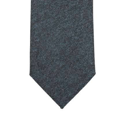 Dark blue woven tie with a pointed tip, handmade in England from pure wool by Seaward & Stearn.
